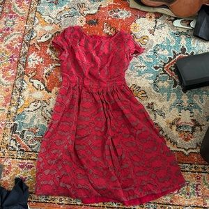 Size 6 women’s anthropology dress. Red and patterned.